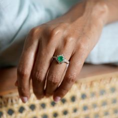 Gold(14K) : 3.07gDiamonds : (VS clarity & H-I colour) : (Brilliant cut) : 0.70ctGemstone : Emerald : 0.70ct May Birthstone Diamond Ring With Halo Setting, Diamond Ring With Halo Setting And May Birthstone, Gia Certified Dazzling Round Emerald Ring, Gia Certified Dazzling Emerald Ring, Dazzling Gia Certified Round Cut Emerald Ring, May Birthstone Diamond Cluster Ring With Brilliant Cut, Diamond Cluster Ring With Brilliant Cut For May Birthstone, Emerald Ring With Brilliant Round Cut For Proposal, Brilliant Cut Diamond Ring For May Birthstone