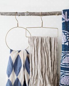 two towels are hanging on a clothes rack