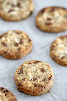 chocolate chip cookies sitting on top of a baking sheet