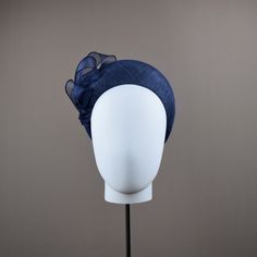 This very flattering halo crown style is very much in vogue this season. This one has been hand blocked and wired using traditional millinery techniques. Formed from lined navy sinamay straw. Embellished with organza ribbon.   Also available in black.  MADE TO ORDER - Please allow one week (2 weeks at busier times eg May/June) However if you need your headpiece urgently please choose Next Day Delivery at checkout and provide us with the date it is required. Your order will be given priority and Blue Headband For Kentucky Derby, Adjustable Blue Headband For Kentucky Derby, Adjustable Blue Headband Fascinator, Blue Adjustable Headband Fascinator, Blue Formal Hair Accessories For Kentucky Derby, Adjustable Headband For Church, Adjustable Blue Hair Accessories For Royal Ascot, Elegant Blue Headband For Kentucky Derby, Blue Headband For Royal Ascot