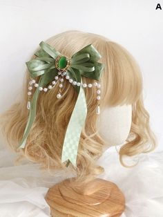 Enhance your hairstyle with our charming green beaded chains bowknot hairclip. This exquisite accessory features a delicate green bow adorned with shimmering beads and elegant chain details, adding a touch of sophistication to any look. Perfect for both casual and formal occasions, this hairclip effortlessly combines style and functionality, ensuring your hair stays in place while you shine. Embrace a blend of kawaii and chic with this must-have hair accessory. Fairy Core Hair Accessories, Jade Hair Accessories, Whimsical Hair Accessories, Cottagecore Hair Accessories, Light Green Accessories, Victorian Hair Accessories, Hairstyle Beads, Pixie Accessories, Light Green House