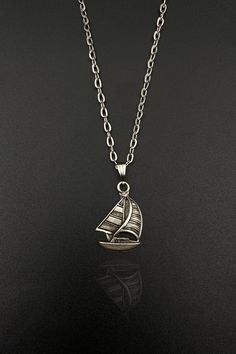 Set sail on a journey of style and elegance with our Sailboat Necklace. This unique nautical jewelry piece is a treasure trove for both men and women who have a penchant for the sea and the timeless allure of pirate ships. This handcrafted piece of art is not just a necklace, but a representation of adventure and freedom that the open sea symbolizes. Meet the Safran family with the most beatiful necklace and jewelry. Have a look in our store to see handmade necklace, silver pendant, unisex penda Nautical Style Metal Jewelry Gift, Pirate Necklace, Sailboat Necklace, Ship Necklace, Pirate Ships, Nautical Jewelry, Star Chain, Women Necklace, Free Bracelet