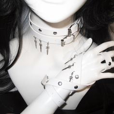 This double-wrap choker is a statement piece that adds an edgy flair to any outfit. The choker features stud embellishments and a distinctive sword pendant, creating a bold and unique look.  Please note that the price includes one choker only. Edgy Choker For Alternative Fashion, Adjustable Punk Choker For Cosplay, Adjustable Punk Style Choker For Cosplay, Trendy Metal Jewelry For Cosplay, Alternative Metal Choker For Cosplay, Edgy Metal Choker For Cosplay, Adjustable Punk Choker For Alternative Fashion, Adjustable Metal Choker For Cosplay, Grunge Choker For Cosplay