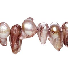 several different types of pearls are arranged in a row on a white background, with one pearl missing