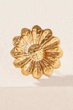 Beautifully detailed blooms are rendered in golden brass. Sterling silver posts. Nickel and lead free. .75" [2 cm] long. Vintage Gold Flower Clip-on Earrings, Gold Metal Flower Charm Earrings, Gold Flower Pendant Brooch Jewelry, Vintage Gold Flower Shaped Jewelry, Gold Brass Earrings With Flower Charm, Gold Flower-shaped Single Earring, Gold Flower Single Earring Jewelry, Single Gold Flower Earring, Silver Brass Flower Earrings