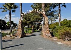 the entrance to solana beach is surrounded by palm trees