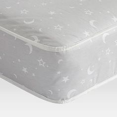 an image of a mattress with stars and moon designs