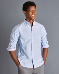 100% cotton, Contrast trim detailing and chest embroidery, Button-down collar, Rounded button cuff with two buttons, Oxford Weave, Natural stretch, Garment washed for a softer finish, Classic and Slim fit: Back pleats, Extra slim fit: Back darts - Button-Down Collar Washed Oxford Stripe Shirt - Ocean Blue Traditional Fit Cotton Tops For Spring, Spring Cotton Tops With Traditional Fit, Traditional Fit Long Sleeve Shirt For Spring, Preppy Cotton Shirt With Button Closure, Charles Tyrwhitt Shirt, Charles Tyrwhitt, Fit Back, Stripe Shirt, Oxford Fabric