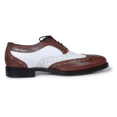 Looking for something that speaks classy? These dual toned oxford shoes should be the perfect fit for your taste. Manufactured using high- quality genuine leather; these pair of shoes carry a distinctive brogue wing-tip design perfect for flaunting at any formal event such as weddings or business gatherings. This product undoubtedly reflects its worth with the unique color contrast of rich coffee brown & white along with its specific finesse and detailed designing on the border of the shoes. The inner soles of the shoes are also lined with leather making for a comfortable, cozy fit throughout the day. Some features of the product that highlight its worth include: Use of premium leather Unique color combination of coffee and white Fashionable brogue wing-tip design Leather padding on the in Leather Top Hat, Purple Leather Jacket, Black Boots Men, Oxford Brogues, Leather Formal Shoes, Brown Oxfords, Bit Loafers, Leather Making, Suede Leather Shoes