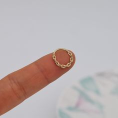 Metal: 14k solid gold, Sell as single piece Available Gold color: Yellow gold  Guaranteed Authentic 14k Gold, Not Plated or Filled Stone:  no stone Thickness: 1.2mm(16G) Inner diameter:6/7/8/10/11/12mm Stamp:14k  SHIPPING ADDRESS ●All the orders will ship to the supplied address through your Etsy Order, Please leave your phone number,will give to carrier for safe deliver. ●We will not send and replacement parcels due to incomplete or inaccurate address.  PACKING ●Can be Gift packed including Jewelry Box, Ribbon or Bow and your personlized message.  RETURN/REFUND ● We gladly accept refunds on undamaged goods up to 7 days after delivery in the original packaging. ● Please contact me for asking the return address.  CUSTOMS & DUTY ●Buyer/Customers are responsible for any customs or duties fees Solid Gold Septum Ring, Ear Peircings, Daith Earring, Conch Piercing Jewelry, Daith Earrings, Conch Piercing, Gold Link, Jewelry Earrings Hoops, Tragus