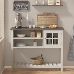 a white shelf with some items on top of it and a basket in front of it