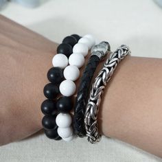 This distance bracelet set makes a great gift for couples, friends, and family. Each complete bracelet has one bead switched with the other, to represent having the other person with you no matter the distance. The high contrast of black and white onyx will bring you a quick reminder of the special people in your life with a glance. Bracelet can be made in different sizes if requested, if no request is made the white bracelet will come in 6.75-7 inch in diameter, and the black will come in appro Casual Braided Bracelets With 8mm Beads As Gift, Casual Braided Bracelets With 8mm Beads For Gifts, Casual Silver Round Beads Wristband, Distance Bracelet, Distance Bracelets, White Bracelet, Couples Friends, White Onyx, White Bracelets