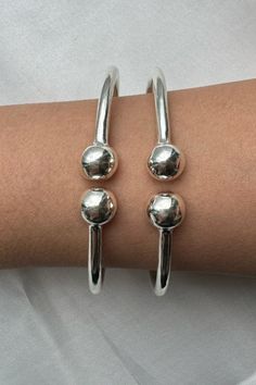 Discover timeless elegance with our .925 Sterling Silver Plain West Indian Bangles. Each bangle is a testament to refined simplicity, handcrafted in the USA to adorn your wrists with a touch of luxe. ✨ With a heavy and thick yet elegant plain design, these ball silver bangles are meant for those who appreciate the true beauty of handmade jewelry. 🌟 Elevate your style with our solid silver pieces that whisper sophistication!
Explore our exquisite Sterling Silver Bangles Collection for an addition to your jewelry ensemble that resonates with elegance and pride. 💫
#BangleBracelets #silverbangles #westindianbangles #westindystyles Fusion Style Sterling Silver Bracelet For Formal Occasions, West Indian Bangles, New Year Style, Bangles Collection, West Indies Style, Indian Bangles, Sterling Silver Bangles, Plain Design, Silver Pieces