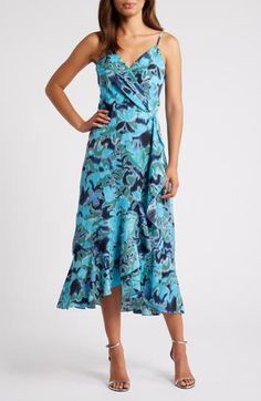 This sleeveless midi, fashioned with a wrapped bodice and a ruffled high/low skirt, is sure to be a warm-weather favorite. 33" to 41 1/2" center front length (size Medium) Hidden back-zip closure Surplice V-neck Adjustable straps Lined 99% polyester, 1% spandex Machine wash, line dry Imported Chic Blue Summer Wrap Dress, Blue Midi Dress With Asymmetrical Floral Print Hem, Chic Blue Wrap Dress For Summer, Blue Sleeveless Midi Dress With Ruffles, Blue Midi Length Wrap Dress For Beach, Casual Blue Wrap Dress With Surplice Neckline, Blue Wrap Dress With Surplice Neckline For Summer, Blue Midi Length Wrap Dress For Summer, Blue High-low Hem Midi Dress For Spring