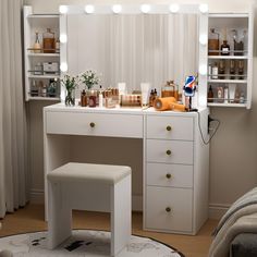 a white dressing table with lights on it