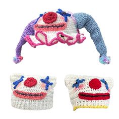 three crocheted pillows with clown faces on them