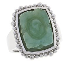 Jade of Yesteryear Carved Jade Flower Sterling Silver Ring Carved green jade blossoms at the center of this contemporary silver ring.       Approx. 13/16"L x 5/8"W x 5/16"H; 1/16"W shank     Stamped .925 sterling silver; platinum plating   Stone Information       All sizes and weights approximate     Light Green Jade - Cushion (16x12mm)     Dark Green Jade - Cushion (16x12mm) Formal Green Flower-shaped Ring, Green Flower-shaped Ring For May Birthstone, Elegant Green Sterling Silver Flower Ring, Green Flower-shaped May Birthstone Ring, Green Flower Rings For May Birthstone, Elegant Green Flower Ring In Sterling Silver, Formal Green Gemstone Flower Ring, Green Gemstone Flower Ring, Green Emerald Flower Ring For Anniversary