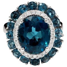 8.45 Carats Natural Impressive London Blue Topaz and Diamond 14K White Gold Ring Total Natural London Blue Topaz Weight: Approx. 8.00 Carats Center Topaz Weight is Approx. 7.00 Carats Center London Blue Topaz Measures: Approx. 12.00 x 10.00mm Natural Round Diamonds Weight: Approx. 0.45 Carats (color G-H / Clarity SI1-SI2) Ring size: 7 (we offer free re-sizing upon request) Ring total weight: Approx. 6.7 grams Disclaimer: all weights, measurements and colors are approximate and may vary slightly Gold Cocktail Ring, Wedding Brooch, Gold Cocktail, Blue Sparkles, Pink Topaz, White Gold Diamond Rings, Halo Diamond Ring, 14k White Gold Ring, White Gold Ring