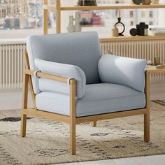 a blue chair sitting on top of a rug