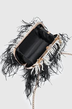 Elevate your style with our Pearl Fringe Feather Handbag. This luxurious accessory seamlessly blends the classic charm of pearls, the playful elegance of fringe detailing, and the exotic allure of feathers. The handbag is a true embodiment of sophistication, perfect for making a statement at upscale events and adding a touch of glamour to your ensemble. Carry it with confidence and let your unique sense of style shine. Luxury Formal Clutch With Tassels, Luxury Formal Bag With Beaded Fringe, Luxury Bags With Beaded Fringe, Luxury Formal Bags With Feathers, Luxury Party Bag With Tassels, Luxury Formal Feathered Bags, Party Clutch Bag With Beaded Fringe, Luxury Evening Bag With Feather Trim, Elegant Bags With Feather Trim For Events