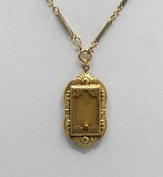 This is a antique gold filled locket made by the JJ White company. This company began business in 1896. I believe this locket is from around the turn of the century. The locket has a sliding mesh door that hides a picture within. I have paired it with a nice gold filled chain that appeared to have some age also. The locket is 1 3/4 by 7/8 inches, the chain is 19 inches. This necklace is in very good to excellent condition for its age with minimal signs of wear to the gold filled plating. The mesh door slides easily and it retains the original photo holder. This beautiful piece of history will arrive in a black velvet pouch. Free shipping. Victorian Filigree Locket Necklace In Yellow Gold, Victorian Filigree Yellow Gold Locket Necklace, Victorian Yellow Gold Locket Necklace With Filigree, Victorian Pendant Locket Necklace For Formal Occasions, Victorian Yellow Gold Pendant Locket Necklace, Victorian Yellow Gold Locket Necklace For Formal Occasions, Antique Yellow Gold Locket Necklace For Wedding, Yellow Gold Filigree Heirloom Locket Necklace, Heirloom Filigree Locket Necklace In Yellow Gold