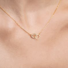 "Introducing the 14K Solid Gold Double Heart Necklace, sure to add a spark of love and elegance to any ensemble. This chic, dainty necklace is inspired by the heart and crafted with the utmost care and attention to detail. Our beautiful 14K Solid Gold Double Heart Necklace is the perfect piece to make you feel extra special. Available in 14K, 10K, and 8K Solid Gold, as well as in 925 Sterling Silver, this stunning handmade jewelry makes a wonderful gift for someone special. With its two double h Two Heart Necklace, Double Heart Necklace, Double Heart, Pretty Gift, Dainty Necklace, Necklace Handmade, High Quality Jewelry, Miami Beach, Heart Necklace