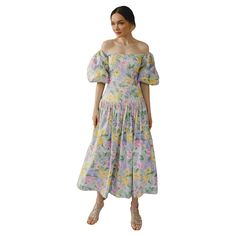 This dreamy vintage 1980s Victor Costa pastel floral dress features the most 1980s shape, including voluminous puff sleeves, and a fitted princess-seam bodice with a dropped waist. It subtly creates an hourglass shape. These puff sleeves are really exaggerated, which I love, with tulle on the interior to help them hold their shape. There is some versatility with the neckline, as the sleeves can be worn off the shoulder, and can also be pulled up and worn on the shoulder; there is hidden elastic at the top of the sleeve that allows it to firmly stay in place no matter how you wear it. The fitted bodice gives way to a fuller skirt— there is a built-in tulle petticoat to support the fullness of the skirt. The pastel floral print feels like it was painted in watercolor, with all the best sprin Victor Costa, Victor Costa Vintage Cocktail Dress Saks 5th Avenue, Victor Costa Dress, Pastel Floral Dress, Multicolor Floral Print Knee-length Puff Sleeve Dress, Calico Dress, Tea Gown, Floral Shift Dress, 1980s Dresses