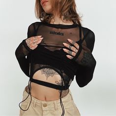 Crop Top Sheer Mesh Material High Neckline Long Sleeves Lined Bust With Buckles Attached Cropped Silhouette Buckle 95% Polyester, 5% Spandex Take Care Of Me Cold Hand Wash Size & Fit Fits True To Size Alexia Is Wearing Size S Alexia’s Stats: Height 5'8", Bust: 32, Waist: 24, Hips: 34, Size 2 Black Stretch Mesh Top Y2k Style, Black Stretch Mesh Top In Y2k Style, Black Y2k Stretch Mesh Top, Fitted Black Y2k Mesh Top, Black Fitted Y2k Style Mesh Top, Black Mesh Y2k Top For Spring, Black Mesh Top Y2k Style For Spring, Black Y2k Mesh Top For Summer, Black Y2k Mesh Top For Spring