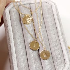 Delicate gold initial disc necklace. Personalized hand stamped gold filled or silver circle necklace. Perfect everyday necklace and great for layering with longer chains or a sweet gift for moms, sisters or friends. *** 14k gold filled, rose gold filled or sterling silver disc. *** Initials stamped by hand. *** Satin finish, hammered or hammered edge. ***Chain is 16"to18"adjustable Disc measurement : 1/2" inches (13mm) diameter. You can choose material ( sterling silver , yellow gold filled or r Dainty 14k Gold Filled Engraved Charm Necklaces, Dainty Engraved 14k Gold Filled Charm Necklaces, Dainty 14k Gold Filled Engraved Charm Necklace, Dainty Hand Stamped 14k Gold Necklace, 14k Gold Filled Initials Necklace For Everyday, Dainty Hand Stamped Round Disc Necklaces, Dainty Hand Stamped Round Disc Necklace, Dainty 14k Gold Filled Hand Stamped Necklace, Dainty Engraved Round Disc Jewelry