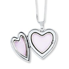 This mother and daughter necklace set features a heart-shaped locket and pendant with an enamel rose. The locket also includes the message "I love you." The set is crafted of sterling silver and comes with 14- and 18-inch box chains so mother and daughter have the perfect fit. Each necklace is secured with a spring ring clasp. Silver Necklaces For Mother's Day, Silver Necklace For Mother's Day, Sterling Silver Necklaces For Mother's Day, Sterling Silver Jewelry For Mother's Day, Double Heart Charm Necklaces For Mother's Day Keepsake, Open Heart Jewelry With Hallmark For Mom's Gift, Open Heart Hallmark Jewelry As Gift For Mom, Open Heart Jewelry With Hallmark For Mom, Open Heart Jewelry With Hallmark As Gift For Mom