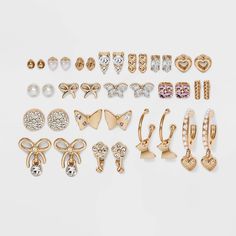 18-piece gold-tone stud and hoop earring set from Wild Fable™ adds glam appeal to your looks. Designs range from simple round stud to faux pearl, butterfly shape and more. Post-back closures help keep the earrings secure. Nickel-free construction suits all types of skin. If you're not satisfied with any Target Owned Brand item, return it within one year with a receipt for an exchange or a refund. Wild Fable™: A look for every story. H&m Earrings Set, Cute Earrings Target, Earrings From Target, Cheap Earrings Website, Where To Shop For Earrings, Teens Earrings, Fanny Pack Fashion, Hoop Earring Set, Butterfly And Flower