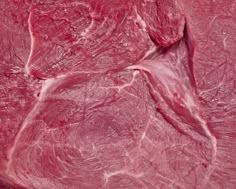 a piece of meat that has been cut into smaller pieces and is shown in red