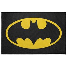 the batman symbol is shown in yellow on black fabric, and it looks like it has been