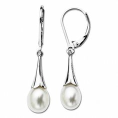 Simply enchanting, these pearl drop earrings complement her feminine style. Crafted in sleek sterling silver, each linear earring features a luminous 9.0 x 7.0mm oval-shaped cultured freshwater pearl suspended within the petal-like ends of a sculpted trumpet-shaped drop. Buffed to a brilliatn luster, these earrings secure with lever backs. Freshwater Pearl Drop Earrings, Freshwater Pearl Earrings, Sterling Silver Drop Earrings, Freshwater Pearls Earrings, Pearl Types, Freshwater Cultured Pearls, Silver Drop Earrings, Pearl Stud Earrings, Pearl Size