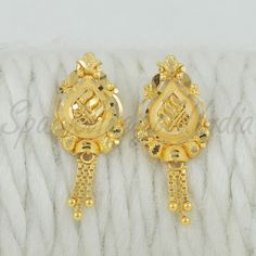 Celebrate the essence of Indian heritage with these radiant 22k gold earrings. Each earring is meticulously designed with traditional patterns that catch the light and add a regal touch to your look. Perfect for both festive occasions and elegant evenings, these earrings are a testament to the rich history of Indian jewelry, offering a blend of classic beauty and modern sophistication. 22k gold earrings handmade jewelry made in India Metal real gold, Purity 22k gold,  length is 2.4 centimeter an Festive 22k Yellow Gold Bridal Earrings, Gold-plated Yellow Gold Danglers With Intricate Design, Gold Dual-tone Earrings For Gift, Yellow Gold Plated Danglers For Celebration, Yellow Gold-plated Danglers For Celebration, Festive 22k Gold Drop Earrings, Dual-tone Gold Earrings For Gift, 22k Yellow Gold Danglers With Intricate Design, Intricate 22k Yellow Gold Danglers