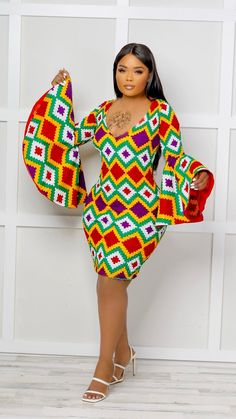 Boss Up in this Efia Kente African Print Midi Dress with majestic sleeves This gorgeous mini dress is ideal for any occasion! Modest but captivating. It can be worn in the office or dressed up for after-work drinks. Perfect For The Efia Kente African Print Midi Dress is perfect for all sorts of functions. Girls night out Casual hangouts Date night Birthday dinner High-end formal events Features V-neckline Non-stretch True to size Mini length Flare sleeve Back zip fastening Extremely flattering f Fitted Multicolor V-neck Dress For Party, Fitted Multicolor V-neck Mini Dress, Fitted Long Sleeve Dress With Bell Sleeves For Party, Multicolor V-neck Formal Dresses, Multicolor Bodycon Party Dress, Multicolor Fitted V-neck Mini Dress, Chic Fitted Mini Dress With Sleeves, Multicolor Sheath Party Dress, Fitted Bell Sleeve Midi Dress For Party