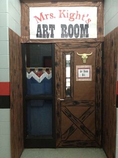 an art room door decorated to look like it is made out of wood