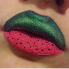 a woman's lips with green and pink lipstick on top of each other in the shape of a slice of watermelon