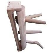 three wooden stools stacked on top of each other in the shape of four legs