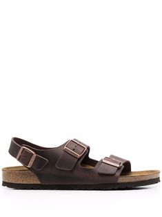 Brown leather/rubber Arizona buckle sandals from BIRKENSTOCK featuring side buckle fastening, open toe, flat sole and buckle-fastening slingback strap. | Birkenstock Arizona buckle sandals Sandals Brown, Brown Leather Sandals, Birkenstock Milano, Buckle Sandals, Birkenstock Arizona, Birkenstock Shoes, Brown Sandals, Birkenstock, Calf Leather