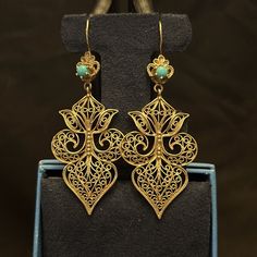 Nwot! 18k Gold Over Bronze Filigree Earrings With Genuine Turquoise Made In Turkey These Are Gorgeous! . I Couldn’t Believe I Found These Packed Up In Back Of My Closet! These Are Nwot! And Vintage! Just Gorgeous. Metal:18k Gold Plated Over Bronze Gemstone: Turquoise Dimensions: 69 Mm X 27 Mm Weight: 8.13 Grams Filigree Jewelry, Turkey Colors, Filigree Earrings, Gold Filigree, Genuine Turquoise, Earrings Jewelry, Vintage Metal, Women's Earrings, Gold Earrings