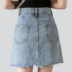 Introducing our 90s-flair raw edge buttoned denim skirt from the 2023 Spring-Summer Collection ââ‚?an iconic piece that promises to add a touch of rebellious sophistication to your wardrobe!Be Bold & BeautifulThis light wash mini skirt is textured to bring out the best in you; the high-waisted fit hugs your silhouette for a flattering look. while the raw edge and button closure adds a hint of edgy flair. Pair it with combat boots for a rocker-chic vibe. or dress it up with a blouse for a night o Denim Skirts Online, Denim Button Skirt, Womens Denim Skirts, Rocker Chic, Light Blue Denim, Light Blue Color, Light Wash Denim, Denim Mini, Be Bold