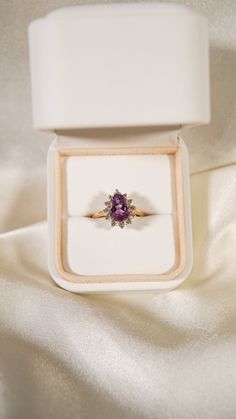 * Ring Material: Amethyst, Diamond, 14K Yellow Gold * Ring Dimensions: 11.8x14.3MM Top Design, 1.5MM Tapering Band * Size: 6.5 * Stone Weight & sizes: Amethyst - 1.70ct, Diamond - 0.20ct * Overall weight: 3.8g 14k Yellow Gold Amethyst Ring With Halo Setting, Wedding Yellow Gold Amethyst Ring With Halo Setting, Yellow Gold Amethyst Ring With Halo Setting For Promise, Fine Jewelry 14k Gold Amethyst Ring With Halo Setting, 14k Gold Purple Halo Setting Ring, Purple Pear-shaped Ring With Prong Setting, Yellow Gold Amethyst Diamond Ring With Halo Setting, Purple Rose Cut Diamond Rings In 14k Gold, Purple 14k Gold Ring With Rose Cut Diamonds