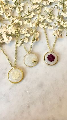 "**PLEASE READ CAREFULLY** Introducing our exquisite handmade breast milk necklaces, crafted with the utmost care and personalized with your own precious breast milk. Each necklace is a unique keepsake, capturing the essence of your breastfeeding journey in a stunning pendant. You have the option to enhance your necklace with a delicate shimmery powder or the inclusion of birth flowers, adding a personal touch that makes it truly yours. Even if you're no longer breastfeeding, we can recreate the appearance of breast milk using our milky shimmery powder, ensuring that your necklace is a timeless reminder of this special bond. Our meticulous process for creating breast milk jewelry takes approximately 1-2 weeks, ensuring attention to detail and quality craftsmanship. Each pendant is delicate Handmade White Charm Necklaces For Mother's Day, White Handmade Charm Necklace For Mother's Day, Handmade White Charm Necklace For Mother's Day, White Birth Flower Jewelry For Keepsake, Delicate White Necklace For Mom, White Birth Flower Jewelry Keepsake, White Birth Flower Keepsake Jewelry, Handmade White Charm Necklace For Her, Delicate Handmade White Charm Necklaces