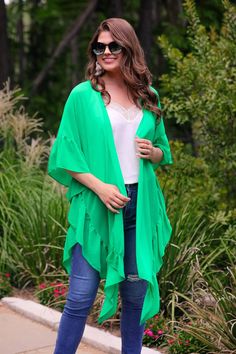 This item is available for local pick up from Magnolia, TX or select a shipping option and have it shipped directly to you. Spend over $99 and shipping is on me! The Delilah Ruffle Kimono is a versatile kimono that doubles as a stylish swim cover-up! It can also be dressed up or down for any occasion. Pair it with a tank top and jeans for a casual look or wear it over a dress. It’s an open front style, a lightweight fabric, and a ruffle side. The loose and flowing silhouette ensures comfort and One Size Kimono For Layering In Spring, Chic Green Spring Kimono, Chic Green Kimono For Spring, Flowy Green Spring Kimono, Green One-size Open Front Kimono, Green Kimono For Fall Vacation, Green Open Front Kimono One Size, Green Open Front One Size Kimono, Green Open Front One-size Kimono