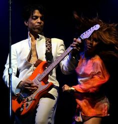 a man and woman are performing on stage