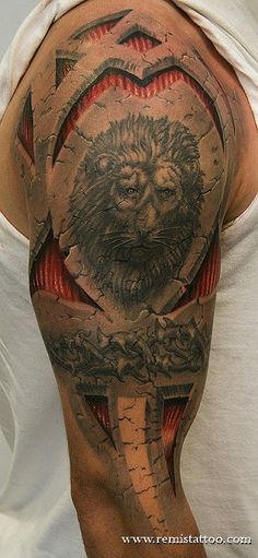 a man with a lion tattoo on his arm and shoulder, holding a knife in the other hand