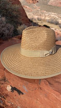 Our Palm Desert Panama fit in perfectly on our latest road trip photo shoot. Stunning, classic, chic - everything you've ever wanted in a hat. Featuring a molded crown with a pinched 10cm brim and hand woven straw, it's crystallized on the tone on tone ribbon with a simple Swarovski rivet. -Rancher style hat with a chill & casual vibe-Brim is flexible but holds its shape-Coordinating ribbon band-Pinched top-Great quality-- will last forever-This color actually goes with everything effortless Elegant Braided Brimmed Sun Hat, Classic Summer Sun Hat With Visor, Straw Panama Hat With Visor For Travel, Classic Brimmed Woven Straw Hat, Elegant Wide Brim Braided Hats, Elegant Braided Hat With Curved Brim, Classic Woven Straw Sun Hat, Woven Straw Fedora For Travel, Classic Woven Sun Hat For Kentucky Derby