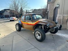 an off road vehicle parked in front of a building