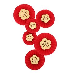 four red paper fan shaped like flowers on a white background